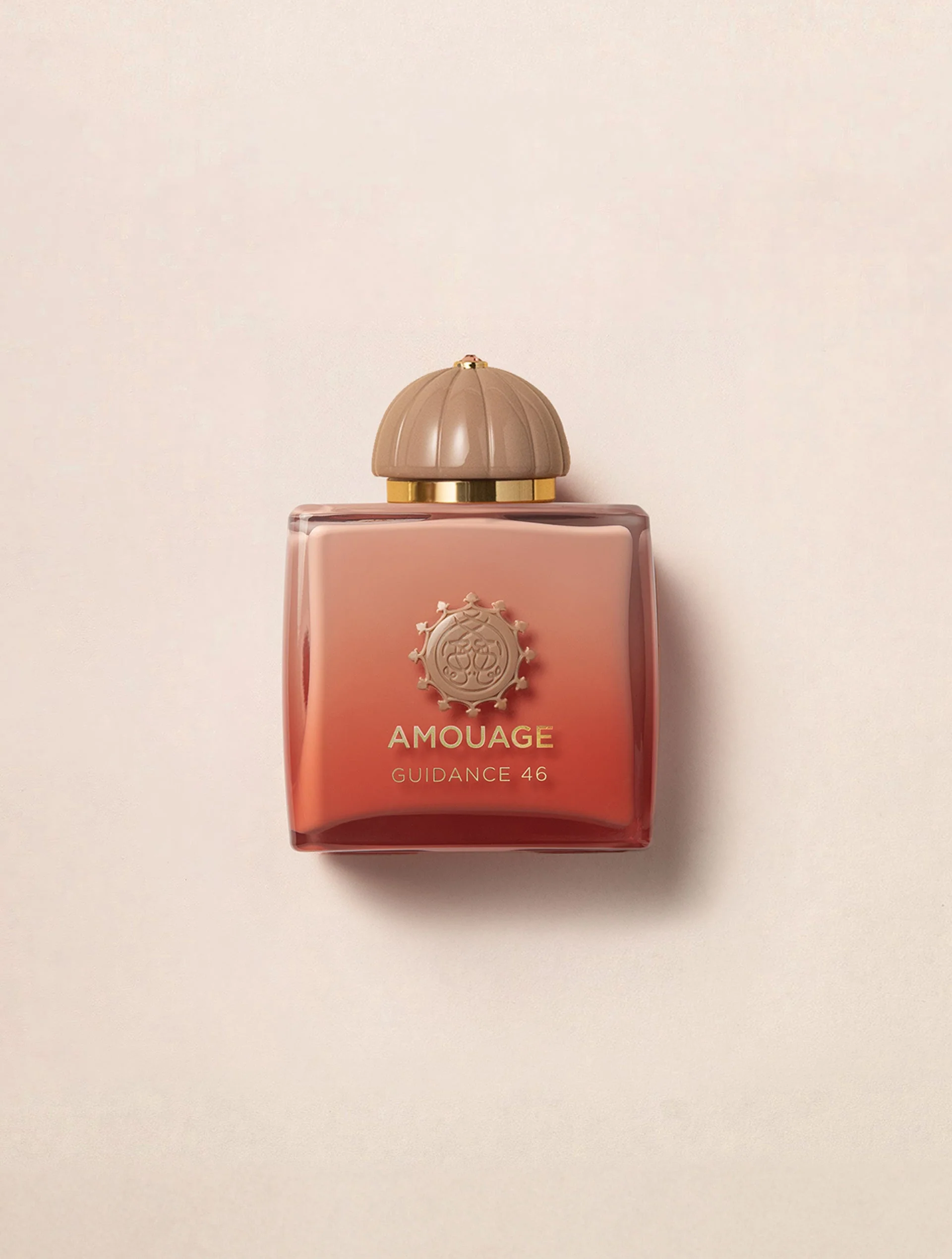 Amouage Guidance perfume on a warm cream background
